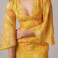 Flirty and playful, this party-wear western dress is perfect for summer events. Delicate lace trim and bell sleeves add elegance while lightweight muslin ensures comfort
