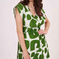 Relaxed fit bodice with extended cap sleeves, highlighting the modern geometric pattern in contrasting shades.