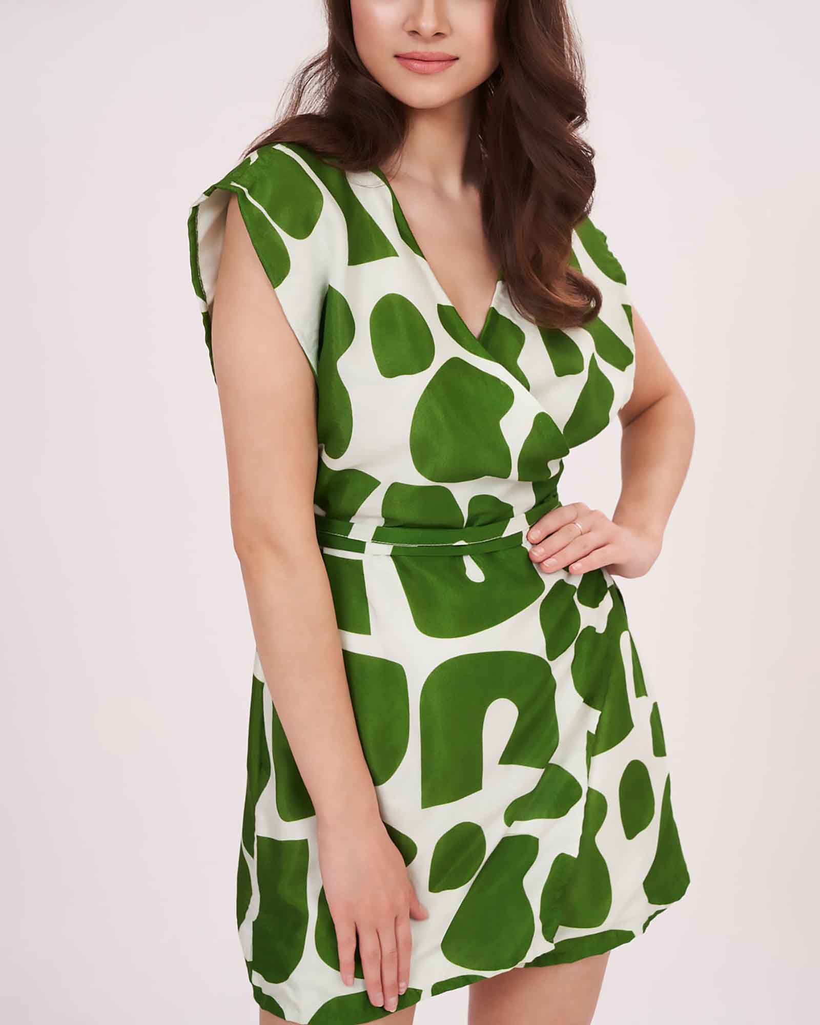 Relaxed fit bodice with extended cap sleeves, highlighting the modern geometric pattern in contrasting shades.