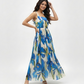 Elegant pleated maxi dress with a structured bodice and delicate straps, ideal for outdoor brunches and festive daytime events.