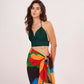 Deep green halter-neck crop top featuring a plunging neckline and backless tie-up design for a sleek, adjustable fit.
