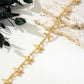 A delicate gold-toned chain anklet featuring a beautifully detailed starfish charm and a tiny accent bead, perfect for adding a touch of seaside elegance to your summer date night.
