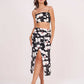 Full view of the black floral spaghetti strap co-ord set with the model standing straight, showing skirt length and fit.