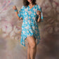 Blue floral georgette dress with shell-detailed slit sleeves, worn in kimono style with relaxed fit.