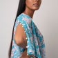 Lightweight blue floral georgette dress with an asymmetric hem, perfect for poolside lounging and resort vacations
