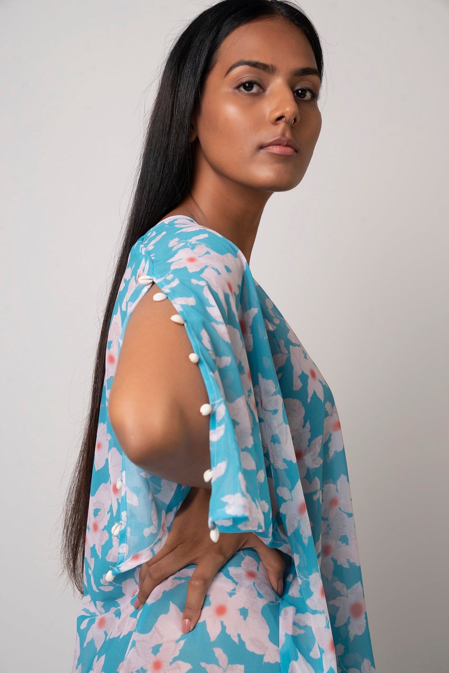 Lightweight blue floral georgette dress with an asymmetric hem, perfect for poolside lounging and resort vacations