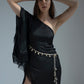 Studio pose with both hands lifted behind head, showcasing neckline and fringe design.