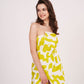 Yellow printed strapless muslin dress with a front slit, ideal for resort parties and vacation evenings