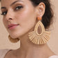 Brown geometric rattan earrings with a lightweight woven design.