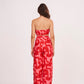 Back view of a strapless crop top featuring a secure fitted design paired with matching high-waisted trousers.