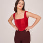 Crepe co-ord set featuring a red corset top paired with brown trousers