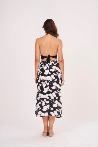Open back bodice design with a secure tie-up knot detail and a straight-cut printed midi skirt.