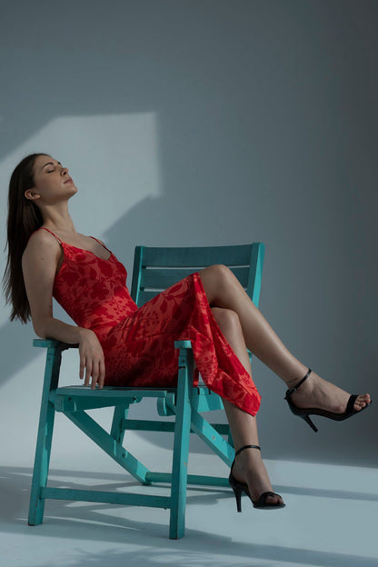 Red floral printed muslin dress with a high-low hem, ideal for summer vacations and daytime outings