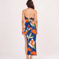 Backless silhouette with adjustable self-tie straps at the neck and reverse for a customized fit.