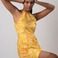 Yellow floral muslin wrap dress with lace accents, ideal for resort wear and summer vacations