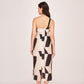 Back view of a one-strap silk midi dress with a back zip closure and clean lines
