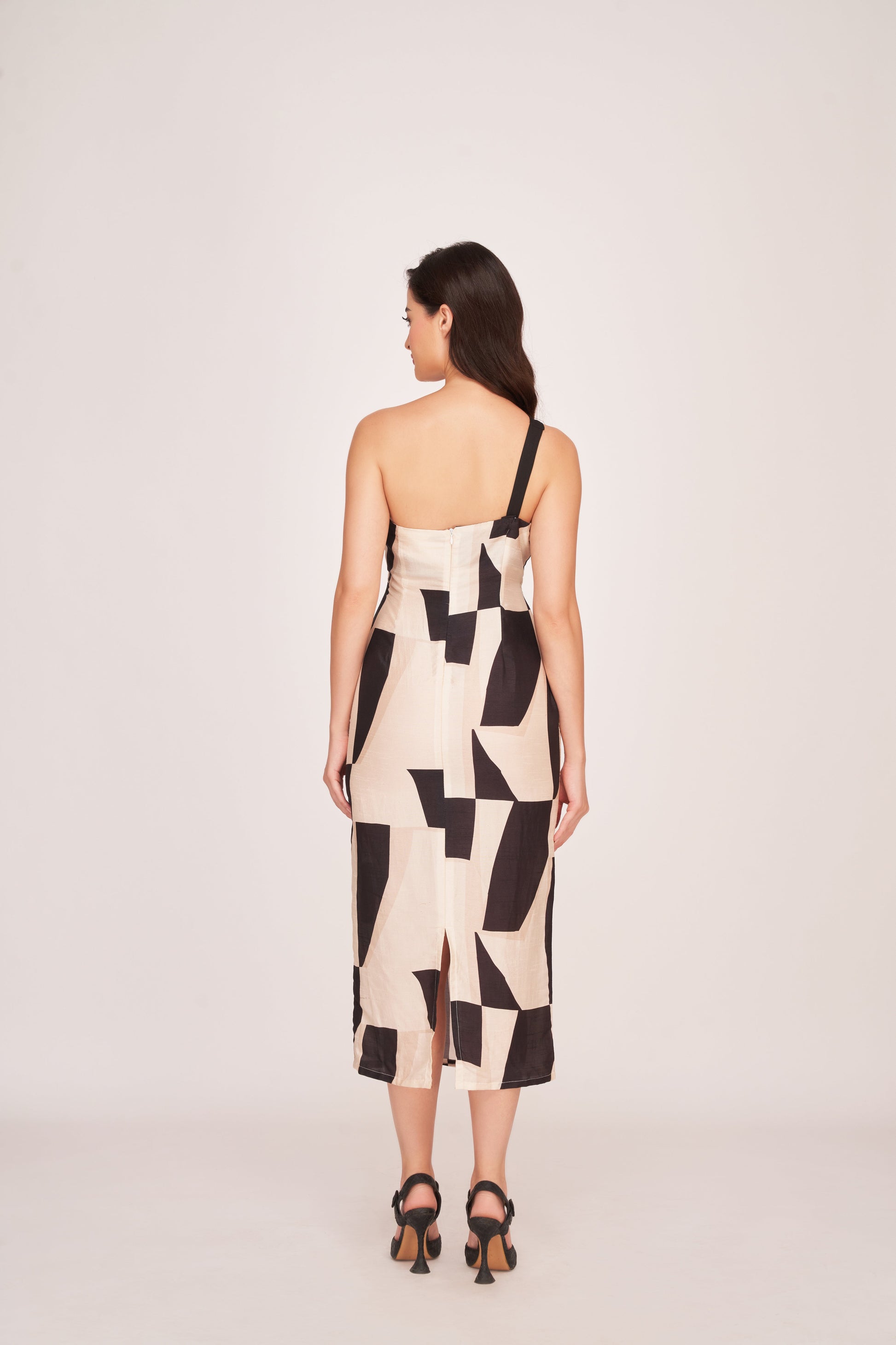 Back view of a one-strap silk midi dress with a back zip closure and clean lines