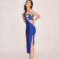 Two-tone ensemble showcasing an abstract geometric print bodice in cream and blue, contrasting sharply with the solid royal blue skirt. 