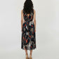 V-shaped back design with and a gathered waistline, showcasing the fluid drape of the lightweight skirt.