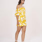 Yellow muslin dress with an off-shoulder neckline and a fitted bodice