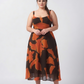 Orange and brown abstract print crepe midi dress with a graceful silhouette, designed for refined resort and daytime occasions