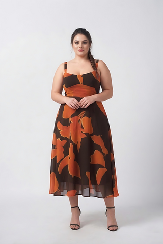 Orange and brown abstract print crepe midi dress with a graceful silhouette, designed for refined resort and daytime occasions