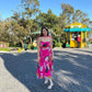 Elegant pink printed midi dress styled for daytime celebrations and brunch outings