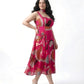 Detail of oversized floral and abstract print on a lightweight pink chinon midi dress