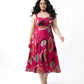 Pink floral chinon midi dress with a sweetheart neckline and tie-up straps, designed for a flattering resort-ready look