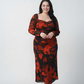 Plus size orange and black floral chinon ankle-length dress with an overlapped neckline and long sleeves