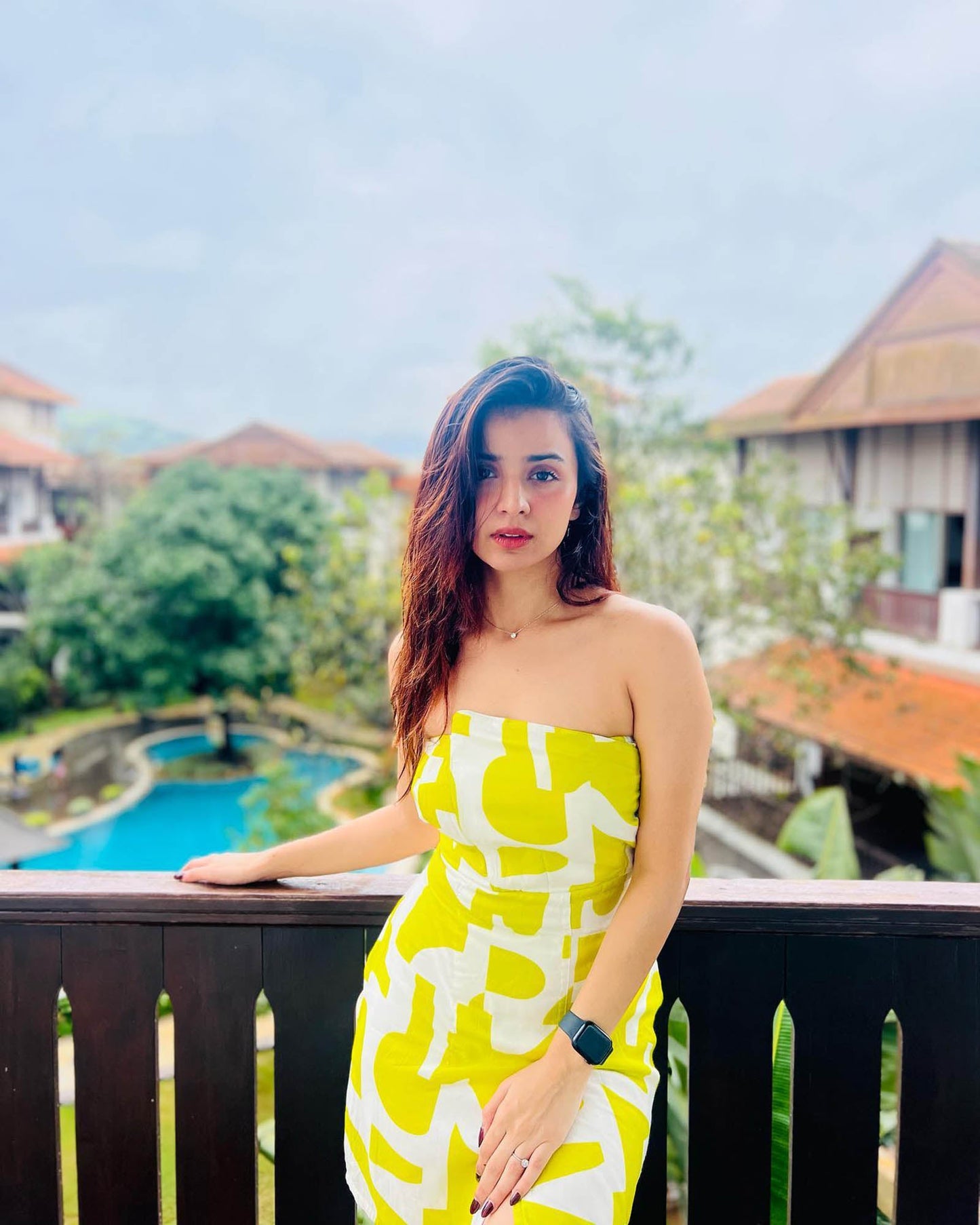 Yellow printed tube dress with an elasticated strapless neckline and sculpted fit