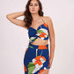Blue halter-neck crop top featuring a twisted bust detail and vibrant orange and white floral print.