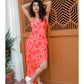 V-neck red muslin dress with strap shoulders, perfect for city strolls, brunches, and warm-weather events