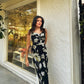 Floral print satin ankle-length dress with a twisted neckline, suitable for elegant daytime events and celebrations