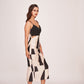 Sleeveless silk midi dress with pleated detailing, ideal for travel, social gatherings, and chic day events