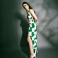  Model in relaxed standing stance with front slit visible, highlighting the skirt movement of the printed green co-ord.