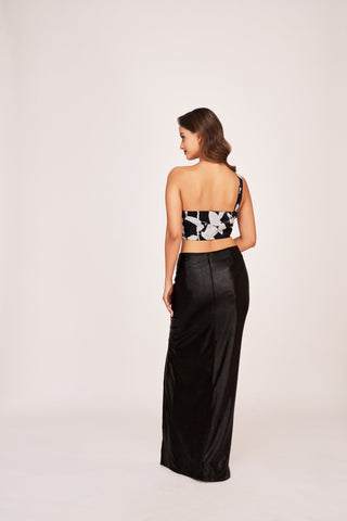 Back profile of the one-shoulder abstract co-ord set showing the clean zip closure and snug fit of the skirt.