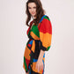 Side view of the short wrap dress showcasing a breezy drape and comfortable summer silhouette.