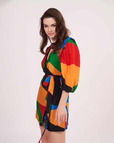 Side view of the short wrap dress showcasing a breezy drape and comfortable summer silhouette.
