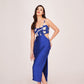 Sleeveless midi dress featuring a daring side waist cutout and a thigh-high side slit that adds movement to the straight-cut skirt. 