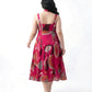 Close-up of sweetheart neckline with adjustable tie-up straps on a pink floral chinon midi dress
