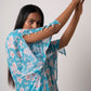Faux georgette dress featuring slit sleeves adorned with delicate sea shell accents
