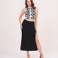 Solid black midi skirt highlighting a daring thigh-high side slit and a sleek, fitted silhouette.