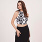 Sleeveless white crop top featuring a bold black abstract geometric print and a high round neckline.