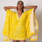 Yellow tie-dye cotton kaftan dress with lace and shell details, ideal for beach vacations and resort wear