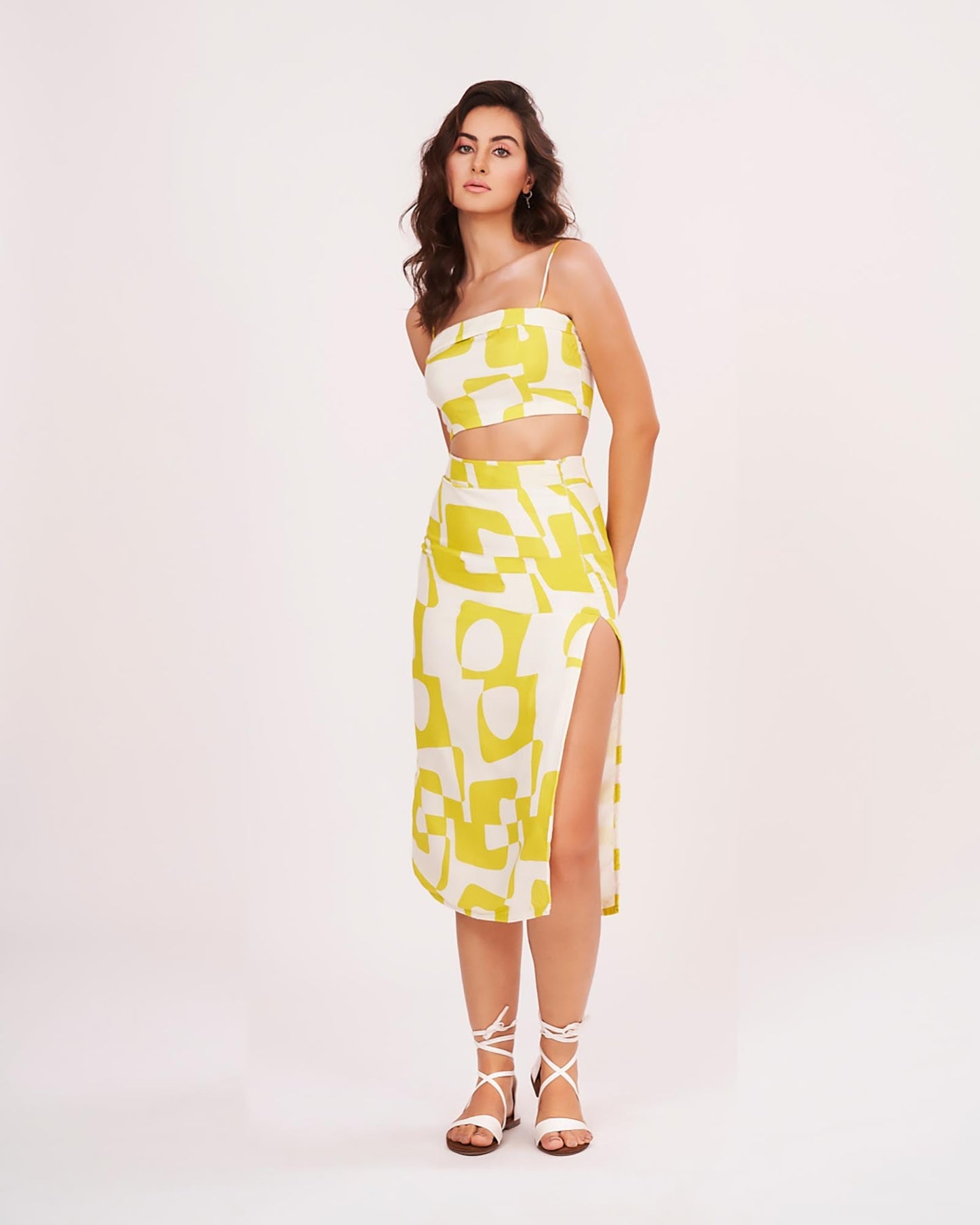 Yellow printed strappy co-ord set, highlighting the square neckline, fitted waist, and thigh-high slit.