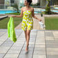 Tube-style yellow muslin dress with an abstract print, perfect for cocktail nights and summer celebrations