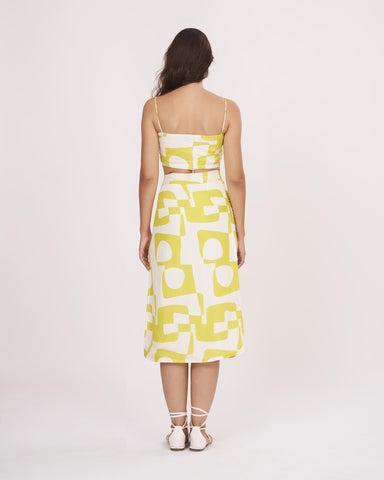 Rear view of the yellow co-ord set showing back zip closure and symmetrical strap detailing
