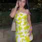 Muslin tube dress featuring accented cut details at the neckline and a front slit